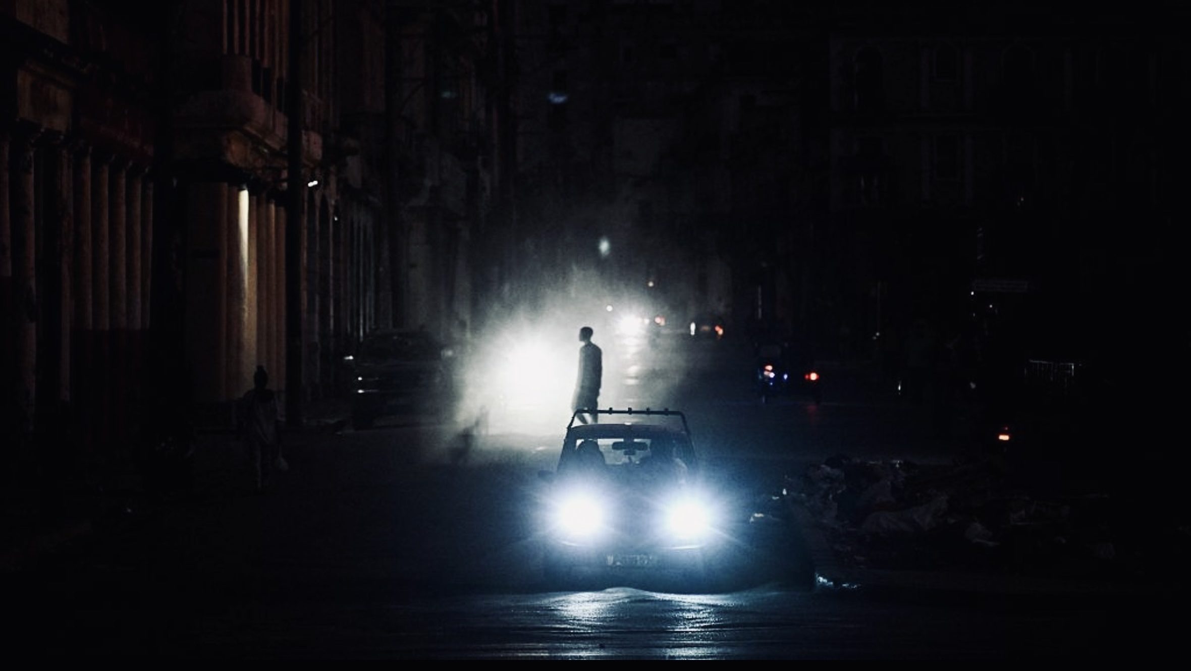 Dark street scene during nationwide blackout in Cuba as energy crisis causes widespread power outages
