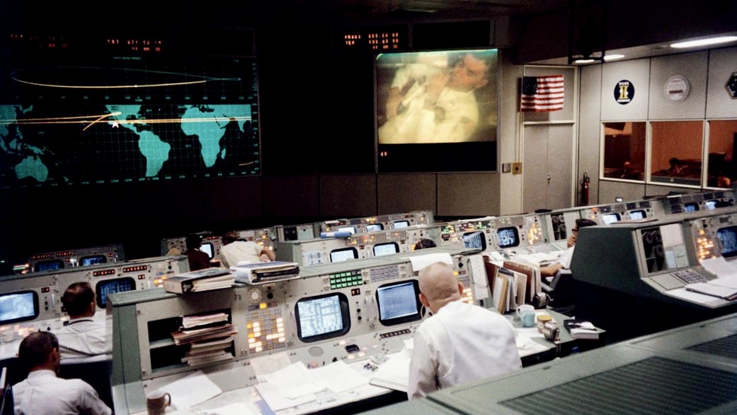 NASA mission control in Houston during the Apollo 13 crisis as engineers monitor spacecraft systems and trajectory