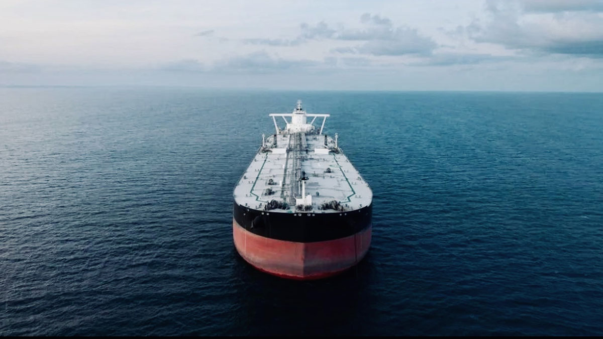 Large oil tanker sailing through open waters in the Strait of Hormuz, highlighting global energy transport routes.