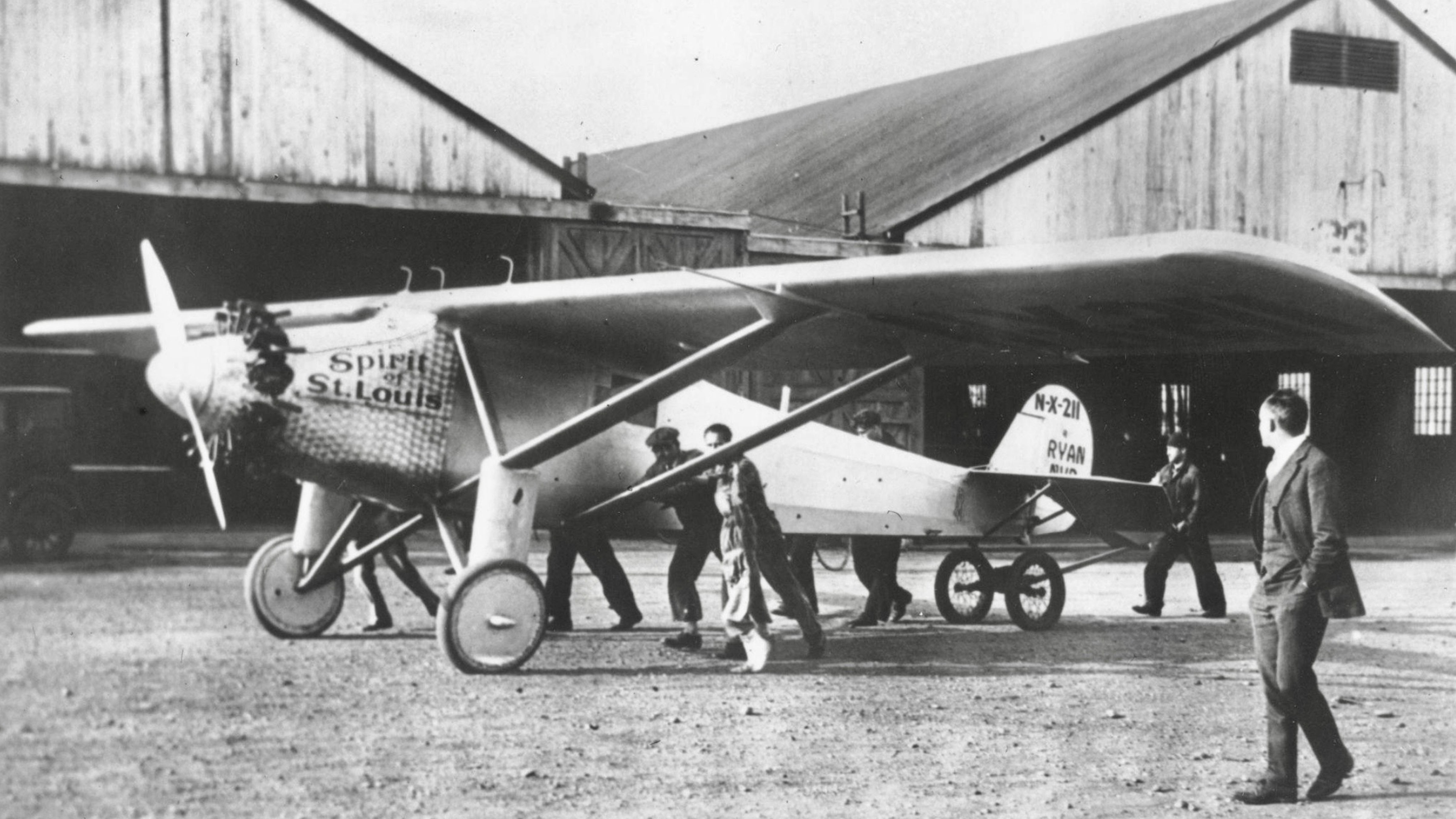 The Spirit of St. Louis aircraft being moved from a hangar before Charles Lindbergh’s historic transatlantic flight in 1927.