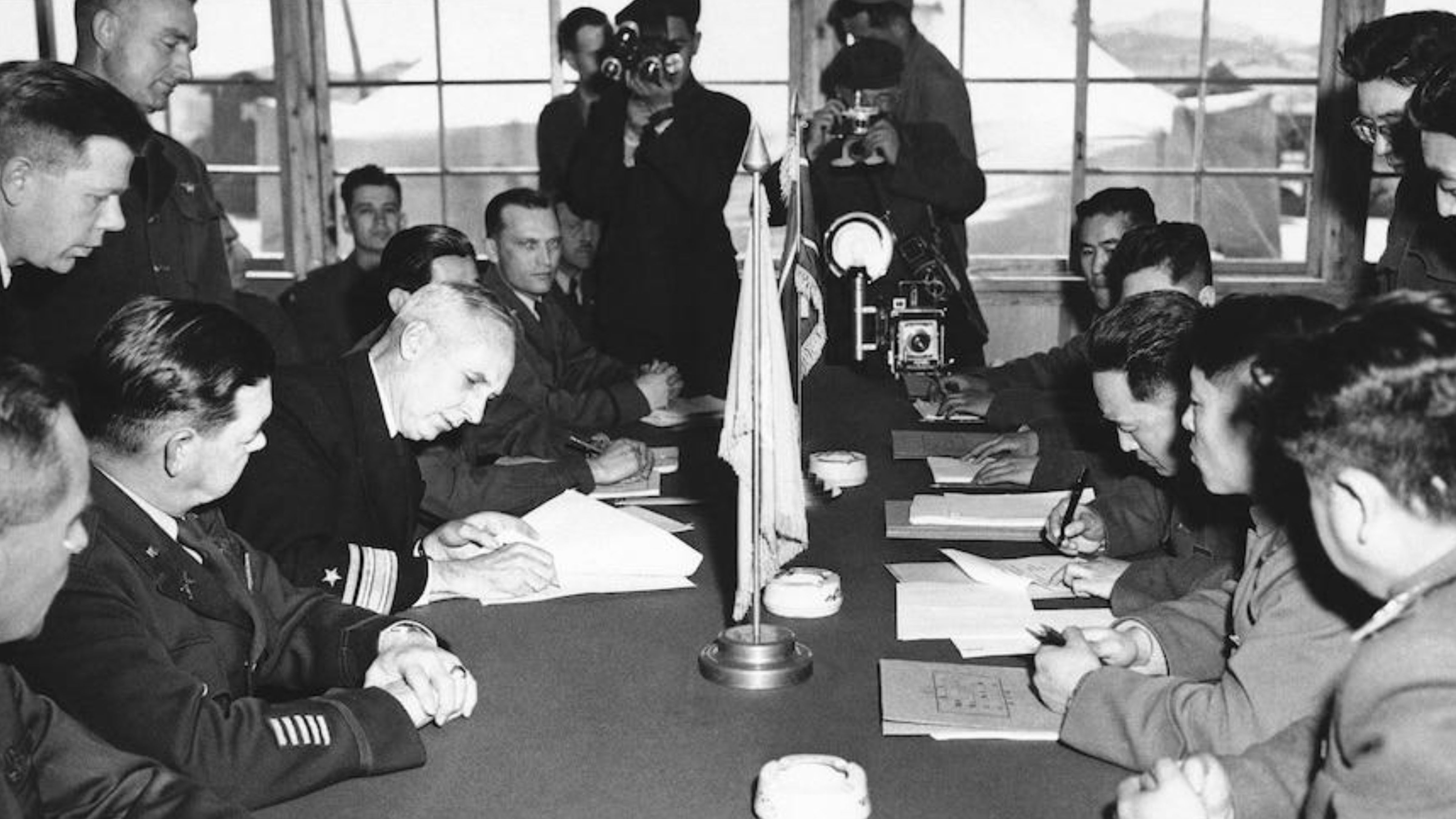 Representatives of the United Nations Command, the Korean People’s Army, and the Chinese People’s Volunteers sign the Korean Armistice Agreement at Panmunjom on July 27, 1953.