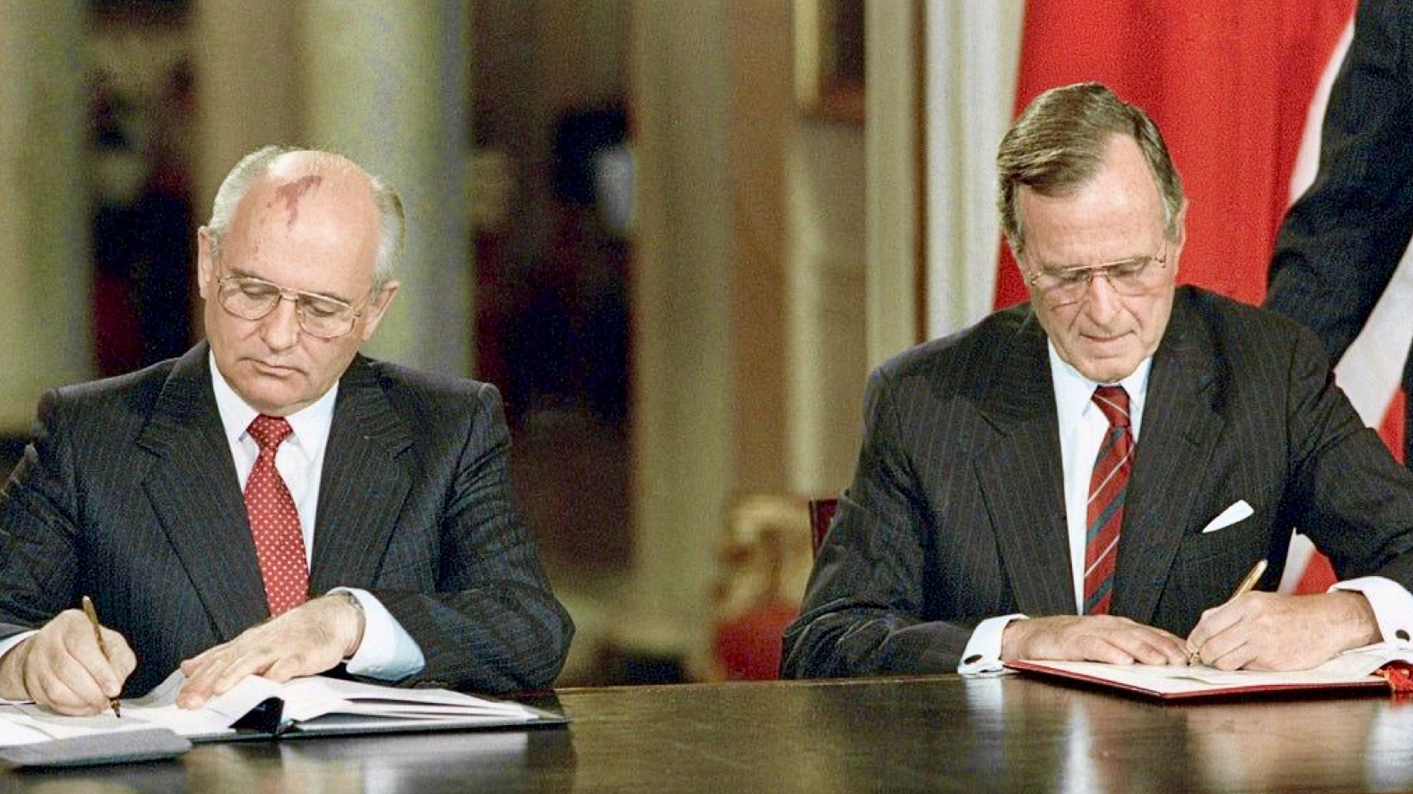 Soviet President Mikhail Gorbachev and U.S. President George H. W. Bush sign the Strategic Arms Reduction Treaty (START I) during the signing ceremony in Moscow on July 31, 1991.