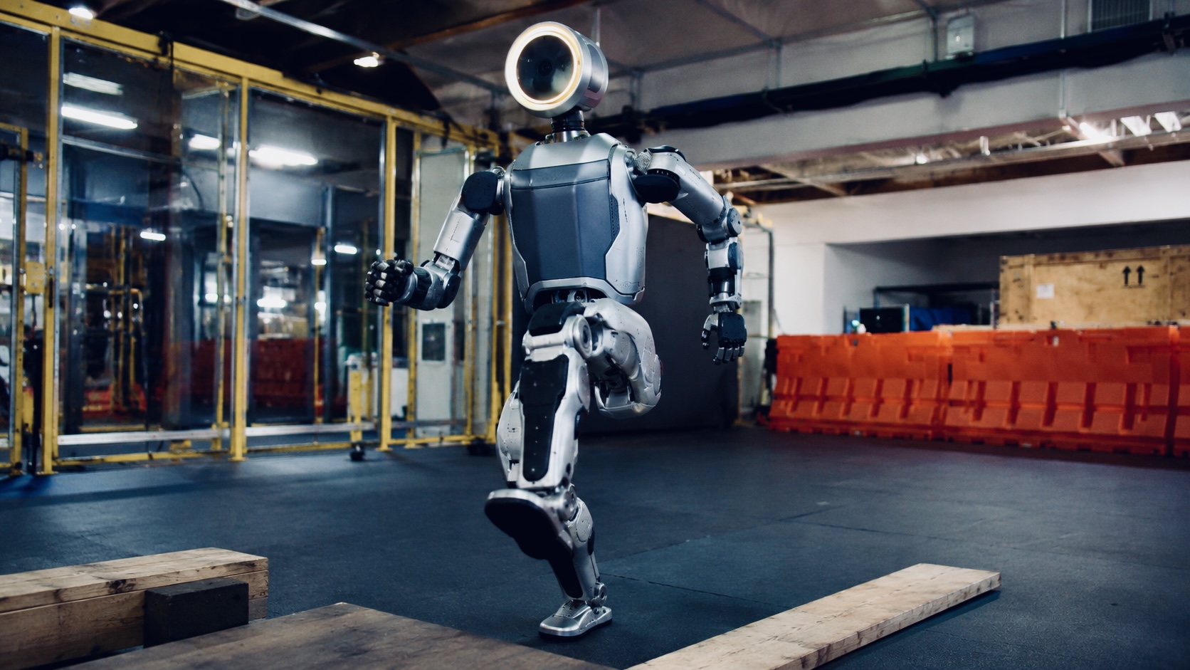 AI-powered humanoid robot navigating obstacles in a robotics testing environment