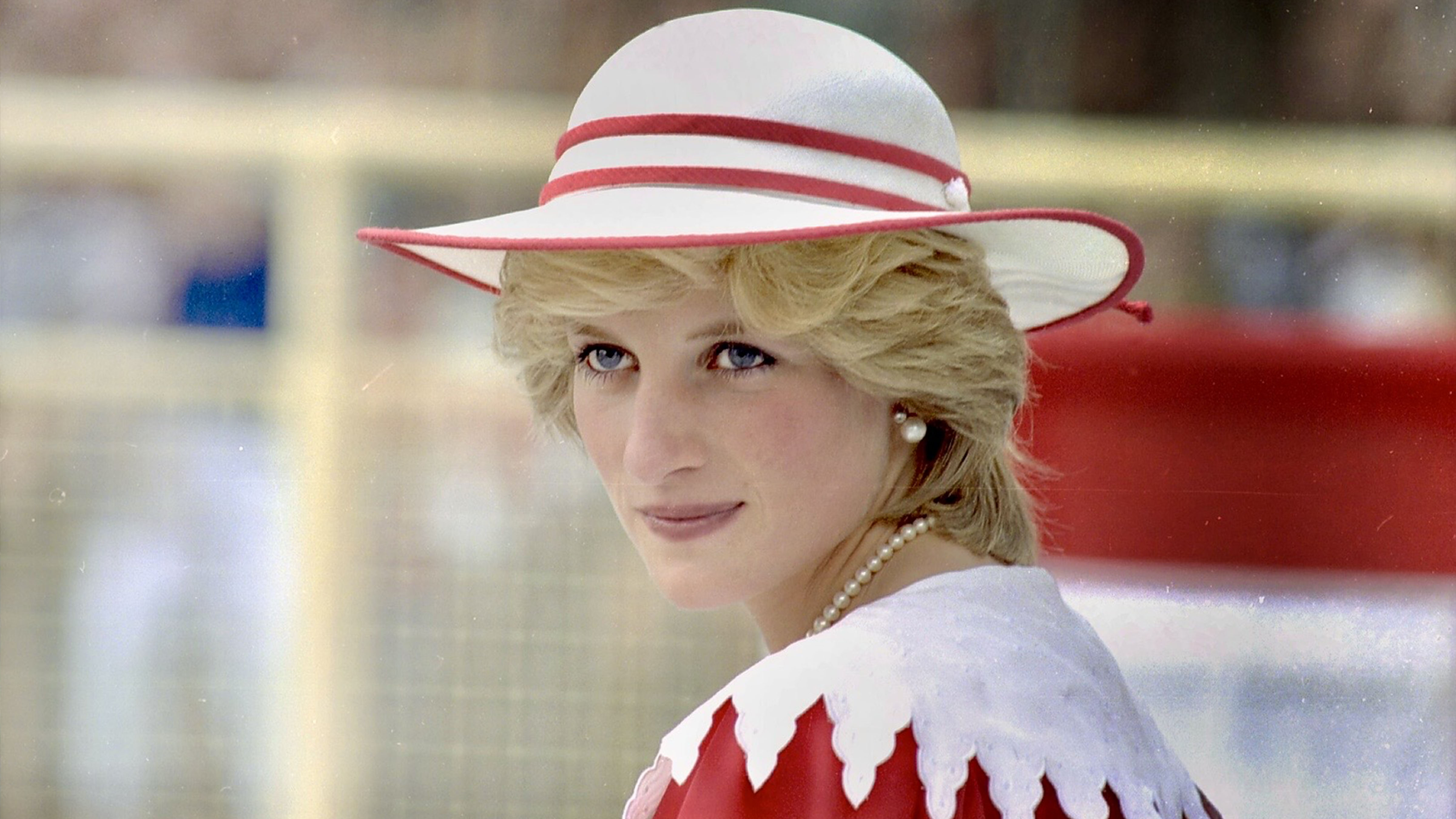 Diana, Princess of Wales, wearing a white and red hat during a 1983 royal visit to Canada.